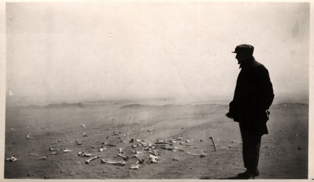 Armenian looking at the human remains of the terrible massacres at Der el Zor in 1915 1916. AGMI